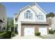 Charming two-story home features a two-car garage and classic architectural details at 2133 Persimmon Ridge Dr, Raleigh, NC 27604