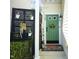 Inviting front entry with green door, potted plants, and decorative accents at 2133 Persimmon Ridge Dr, Raleigh, NC 27604