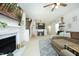 Spacious living room featuring fireplace, hardwood floors, and open floor plan at 2133 Persimmon Ridge Dr, Raleigh, NC 27604
