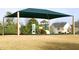 Bright and fun community playground with shaded structure, slides and open space at 2133 Persimmon Ridge Dr, Raleigh, NC 27604