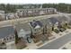Aerial view of suburban homes featuring solar panels, driveways, and neighborhood streets at 219 Begen St, Morrisville, NC 27560