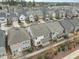 Aerial view of the neighborhood, highlighting the home with its backyard and community features at 219 Begen St, Morrisville, NC 27560