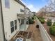 A townhouse backyard features a garden area and covered patio at 219 Begen St, Morrisville, NC 27560