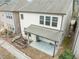 Aerial view of the backyard patio area, with a garden and view of the home's exterior at 219 Begen St, Morrisville, NC 27560