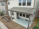 Aerial view of a covered patio and a garden in the backyard of a two-story home at 219 Begen St, Morrisville, NC 27560