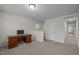 Bright, carpeted room featuring a wooden desk and neutral walls and natural light at 219 Begen St, Morrisville, NC 27560