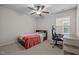 Cozy bedroom with ceiling fan, plush carpeting, natural light, and study area at 219 Begen St, Morrisville, NC 27560