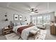 Well-lit bedroom with large windows, tray ceiling, and tasteful decor at 219 Begen St, Morrisville, NC 27560