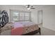 Bedroom with tray ceiling, ceiling fan and natural light at 219 Begen St, Morrisville, NC 27560
