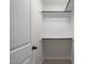 Walk-in closet featuring shelving units, rod and neutral walls and carpet at 219 Begen St, Morrisville, NC 27560