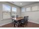 Dining area with a wooden table and four chairs and lots of natural light at 219 Begen St, Morrisville, NC 27560