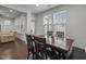 Bright dining area with a dark wood table and views to the exterior at 219 Begen St, Morrisville, NC 27560