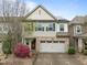 Charming two-story home with stone accents, a two-car garage, and a well-manicured front yard at 219 Begen St, Morrisville, NC 27560