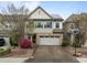 Charming two-story home with stone accents, a two-car garage, and a basketball hoop in the front yard at 219 Begen St, Morrisville, NC 27560