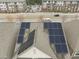 Aerial view of solar panels on the roof of a home near a road and apartments at 219 Begen St, Morrisville, NC 27560