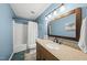 Well-lit bathroom featuring a vanity with granite countertop and a shower-tub combination at 221 Walkers Way, Willow Springs, NC 27592