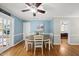 Bright dining room with hardwood floors and space for seating and gathering at 221 Walkers Way, Willow Springs, NC 27592