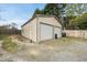 A two-door garage sits in a well-kept gravel lot with secure fencing at 221 Walkers Way, Willow Springs, NC 27592