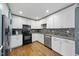 Contemporary kitchen with stainless appliances, granite countertops and backsplash at 221 Walkers Way, Willow Springs, NC 27592
