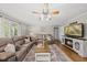 Comfortable living room showcasing a fireplace, plush seating and hardwood floors at 221 Walkers Way, Willow Springs, NC 27592