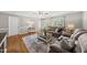 Cozy living room with plush seating, hardwood floors and lots of natural light at 221 Walkers Way, Willow Springs, NC 27592