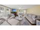 Inviting living room featuring a stone fireplace, hardwood floors, and comfortable seating at 221 Walkers Way, Willow Springs, NC 27592