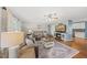 Comfortable living room with a fireplace, plush sofas, and stylish decor at 221 Walkers Way, Willow Springs, NC 27592