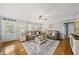 Inviting living room featuring plush sofas, hardwood floors and a ceiling fan at 221 Walkers Way, Willow Springs, NC 27592
