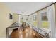 Bright office space with hardwood floors, desk and chair overlooking a green yard at 221 Walkers Way, Willow Springs, NC 27592