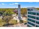 The aerial view of a Bell Tower in a city park with surrounding buildings and mature trees at 2306 Stafford Ave # A, Raleigh, NC 27607