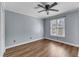 Cozy bedroom with ceiling fan, bright window and neutral color scheme at 2306 Stafford Ave # A, Raleigh, NC 27607