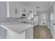 Well-lit kitchen with white cabinets, appliances, and plenty of counter space at 2306 Stafford Ave # A, Raleigh, NC 27607