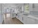 Bright kitchen with white cabinetry, modern appliances, and an open layout at 2306 Stafford Ave # A, Raleigh, NC 27607