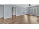 Open-concept living room with modern floors, and neutral wall color at 2306 Stafford Ave # A, Raleigh, NC 27607