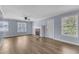 Bright living room with fireplace, updated flooring, and natural light at 2306 Stafford Ave # A, Raleigh, NC 27607