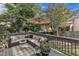 Inviting back deck with plush seating and shade for outdoor relaxation at 2340 Florida Ct, Raleigh, NC 27615