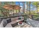 Relaxing back deck with patio furniture and an umbrella for shade at 2340 Florida Ct, Raleigh, NC 27615