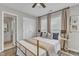 Neutral bedroom with light grey walls, ensuite bath, and walk-in closet at 2340 Florida Ct, Raleigh, NC 27615