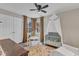 Bedroom featuring a crib with canopy, a cozy rug, and a play table with chairs at 2340 Florida Ct, Raleigh, NC 27615