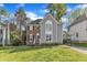 Charming two-story home featuring a brick and gray siding exterior and a well-manicured front lawn at 2340 Florida Ct, Raleigh, NC 27615