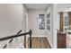 Upstairs hallway with hardwood floors and framed pictures on the wall at 2340 Florida Ct, Raleigh, NC 27615