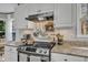 Kitchen with pots hanging on the wall and stainless steel appliances including a range at 2340 Florida Ct, Raleigh, NC 27615