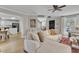 Open-concept space featuring living room with hardwood floors and a view of the kitchen and staircase at 2340 Florida Ct, Raleigh, NC 27615