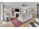 Bright living room featuring a decorative fireplace, plush seating, and hardwood floors at 2340 Florida Ct, Raleigh, NC 27615
