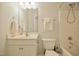 Bathroom featuring a vanity, toilet, and shower-tub combo at 236 Summer Place Ct, Clayton, NC 27527