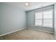 Bedroom features a window, carpeted flooring and a ceiling fan at 236 Summer Place Ct, Clayton, NC 27527