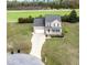 Charming two-story home with a well-maintained lawn, a two-car garage and a cozy front porch at 236 Summer Place Ct, Clayton, NC 27527