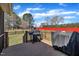 A wooden back deck with a grill and outdoor cooking equipment at 24 High Standard Ln, Angier, NC 27501
