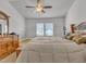 Neutral main bedroom with ceiling fan and natural light at 24 High Standard Ln, Angier, NC 27501