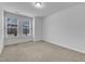 Bright bedroom with neutral carpet, large windows and blinds for natural light at 242 Luftee Ln, Holly Springs, NC 27540